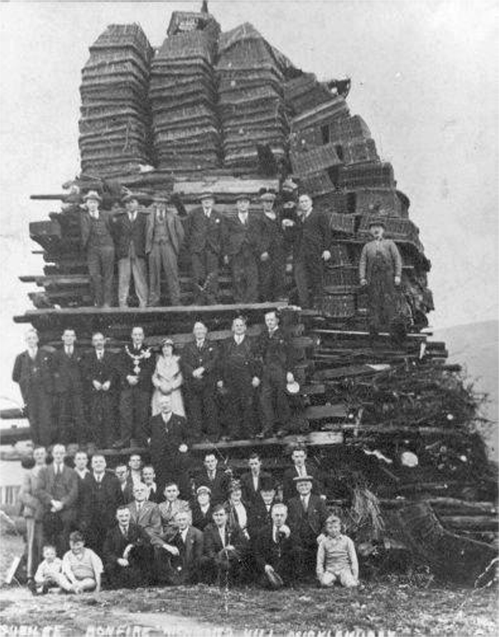 Photo of timber and skip bonfire built in 1930